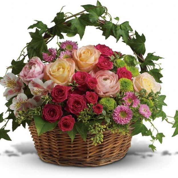 A wild mix of garden blooms in a woven basket.