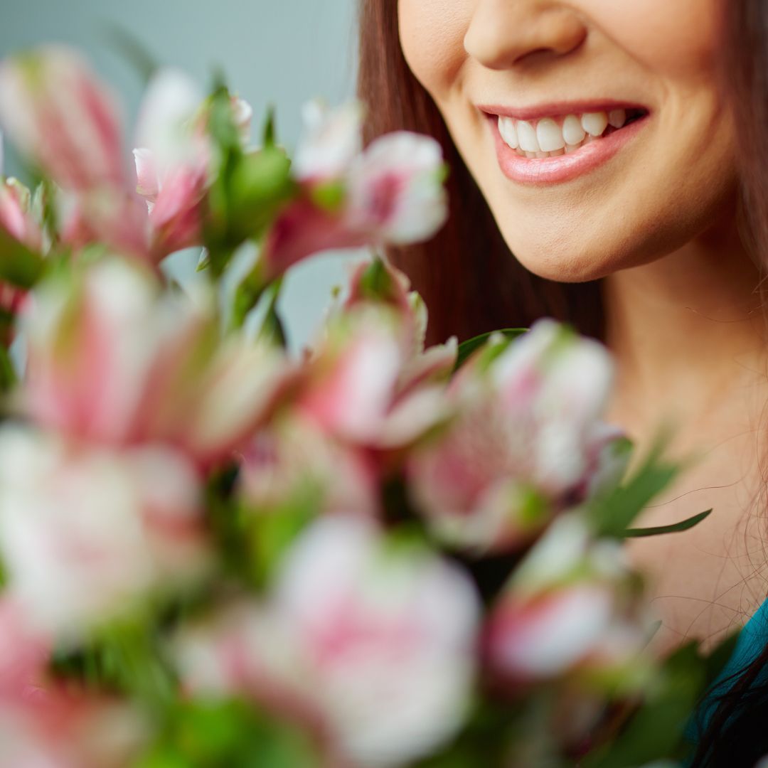 happy woman near flowers