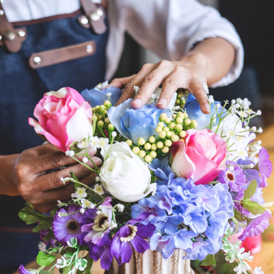 florist arranging flowers for delivery